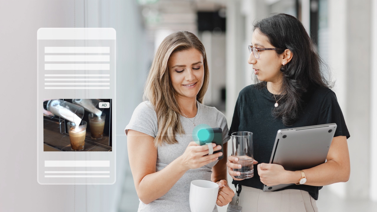 Two women getting coffee